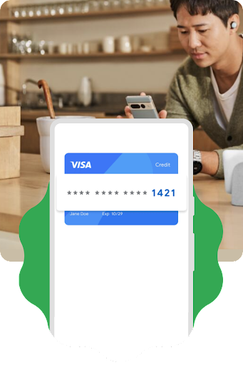 Une image d'une personne assise à table avec son téléphone. Une superposition graphique du schéma d'un téléphone Android présentant une carte de crédit chiffrée est placée sur l'image.