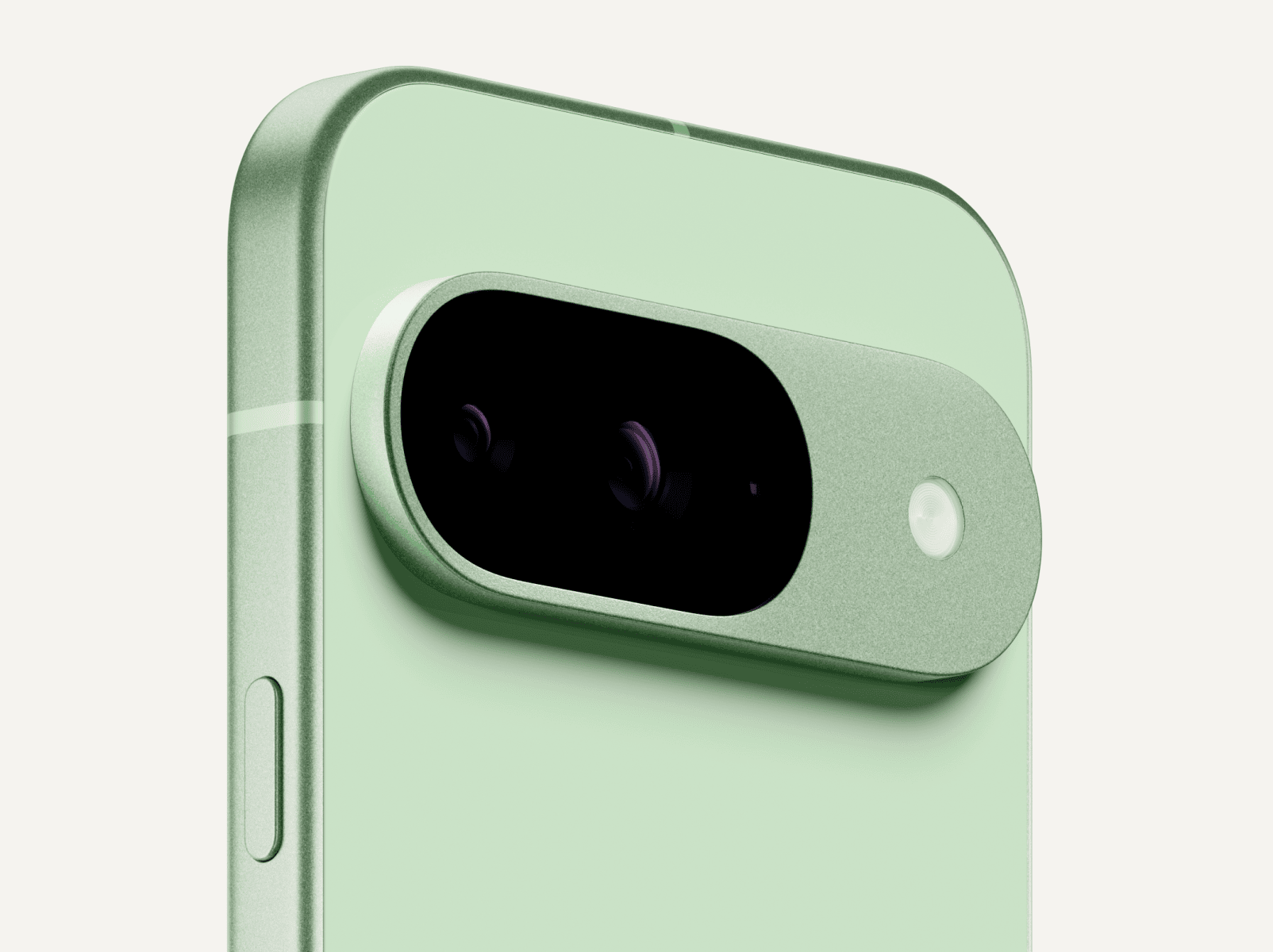 Angled close-up on the back of a Pixel 9 in Wintergreen color.