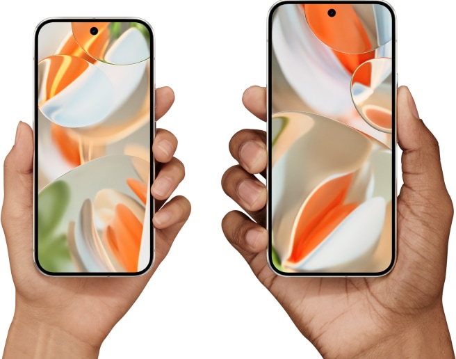 Two hands hold a Pixel 9 Pro and a Pixel 9 Pro XL face-up, comparing sizes.