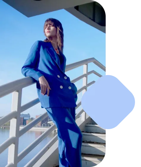 An image of a Lens shopping use case featuring a woman with a blue blazer with an overlapping blue shape.