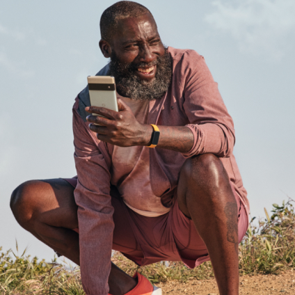 Man in nature wearing Fitbit Inspire 3.