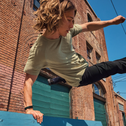 Person wearing Inspire 3 jumping over a bench.