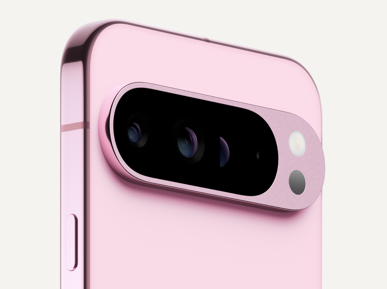 Angled close-up of the back of Pixel 9 Pro XL in Rose Quartz color.