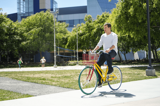 A person riding a Google themed bike