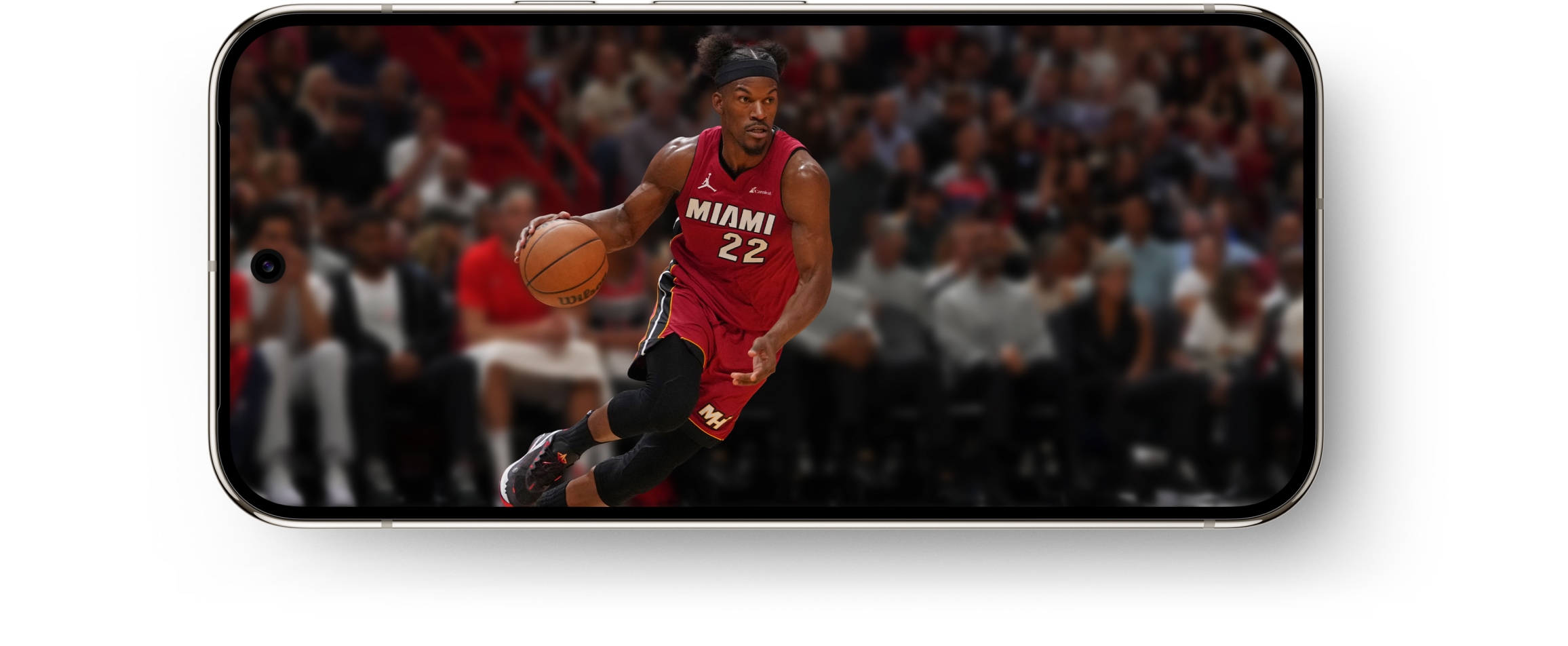 A Pixel 9 Pro turned sideways in landscape mode, showing a men's basketball game on the Super Actua display.