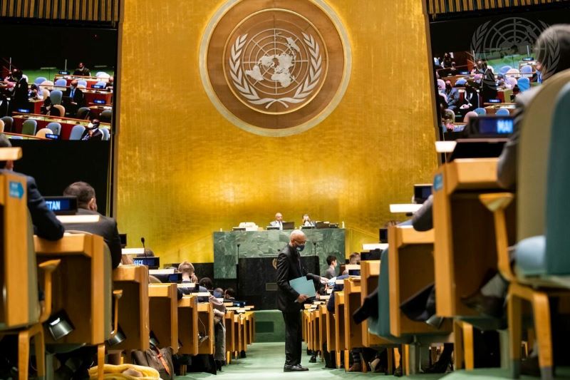 Delegates submit voting ballots during the General Assembly plenary meeting for voting on the election of a member of the International Court of Justice. November 2021