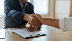 close up of two people shaking hands before job interview