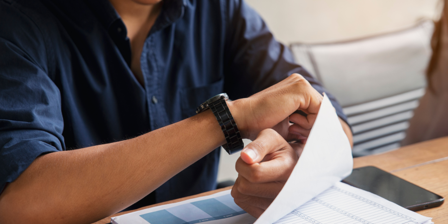 Person checking his watch while at work