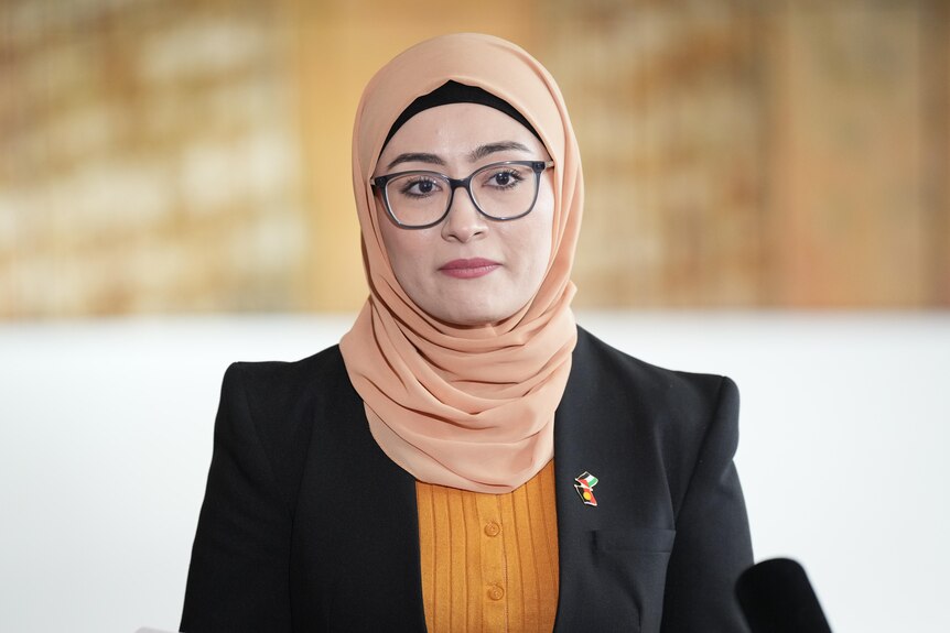 Senator Fatima Payman stands in front of a media pack in Parliament House to announce she's quitting the Labor Party.