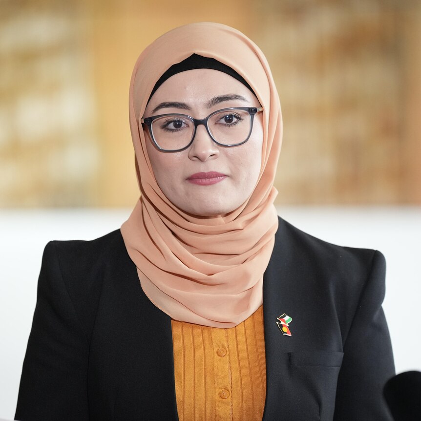 Senator Fatima Payman stands in front of a media pack in Parliament House to announce she's quitting the Labor Party