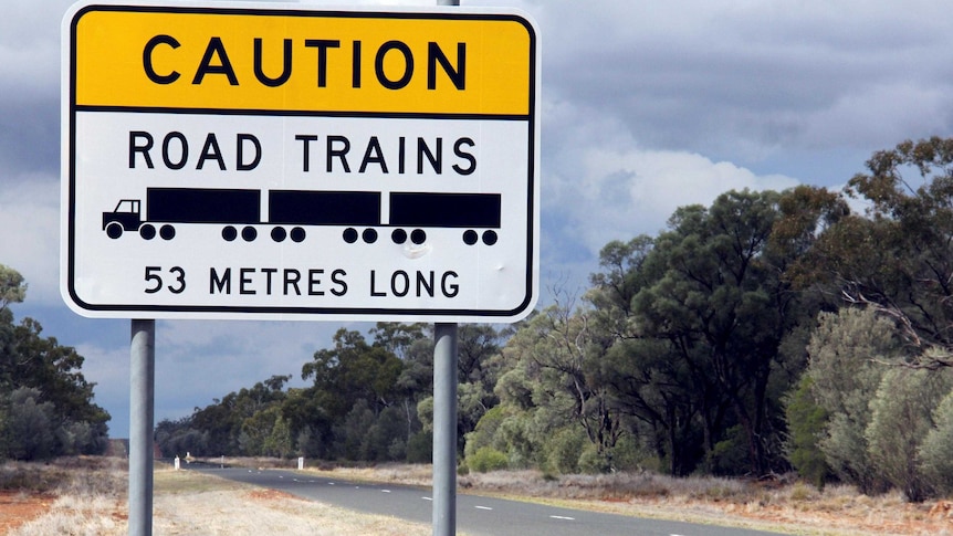 Road train sign by the side of an outback highway.