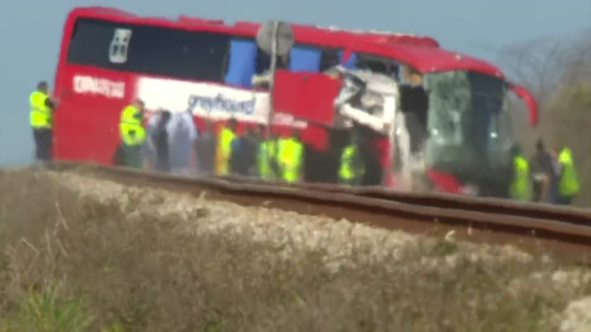 First responders arrive at the scene of a Greyhound bus collision on Bruce Highway.