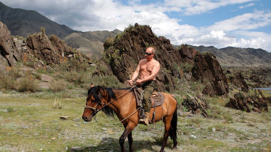 Russia's President Vladimir Putin rides a horse, shirtless, in southern Siberia's Tuva region