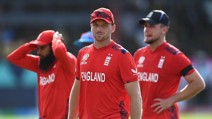 Jos Buttler leads England off after losing to India