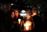 two emotional young women hug at the bondi beach vigil 210424