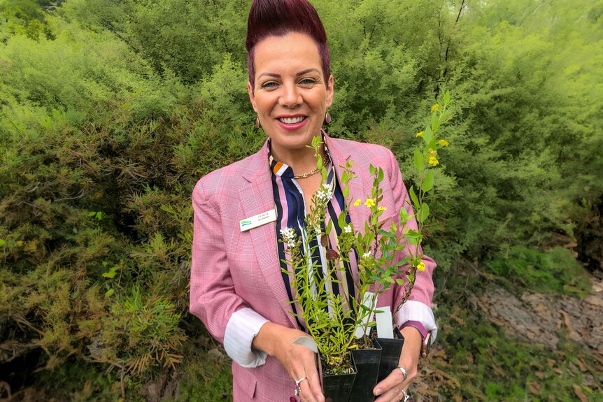 Ally Cunari holding a plant