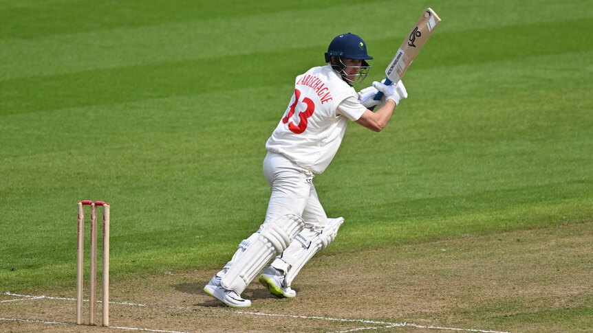 Australian cricketer Marnus Labuschagne looks behind him as he sets off for a run in a county cricket game.