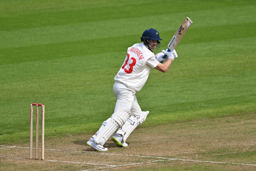 Australian cricketer Marnus Labuschagne looks behind him as he sets off for a run in a county cricket game.