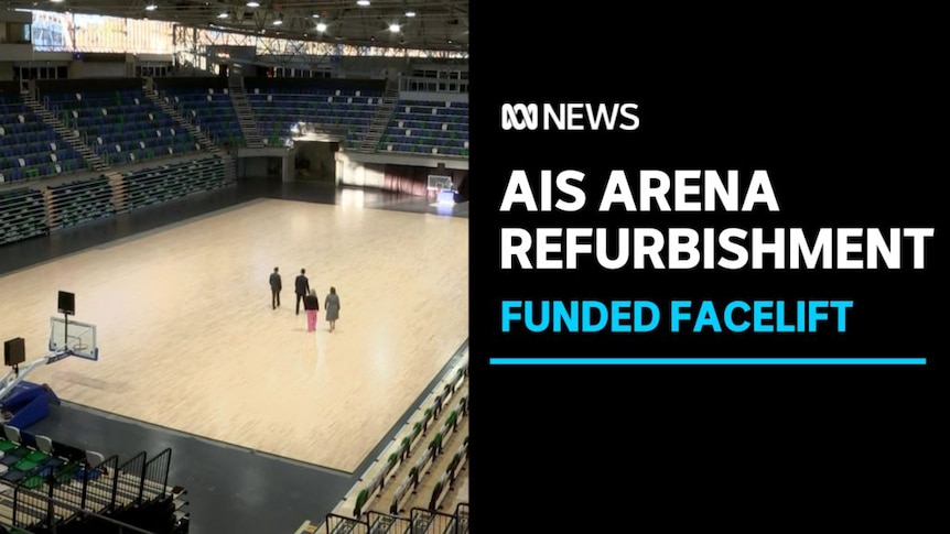 AIS Arena Refurbishment, Funded Facelift: Four people in the middle of an indoor arena with basketball goals at each end.