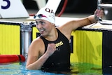 Alexa Leary smiles at the end of the pool