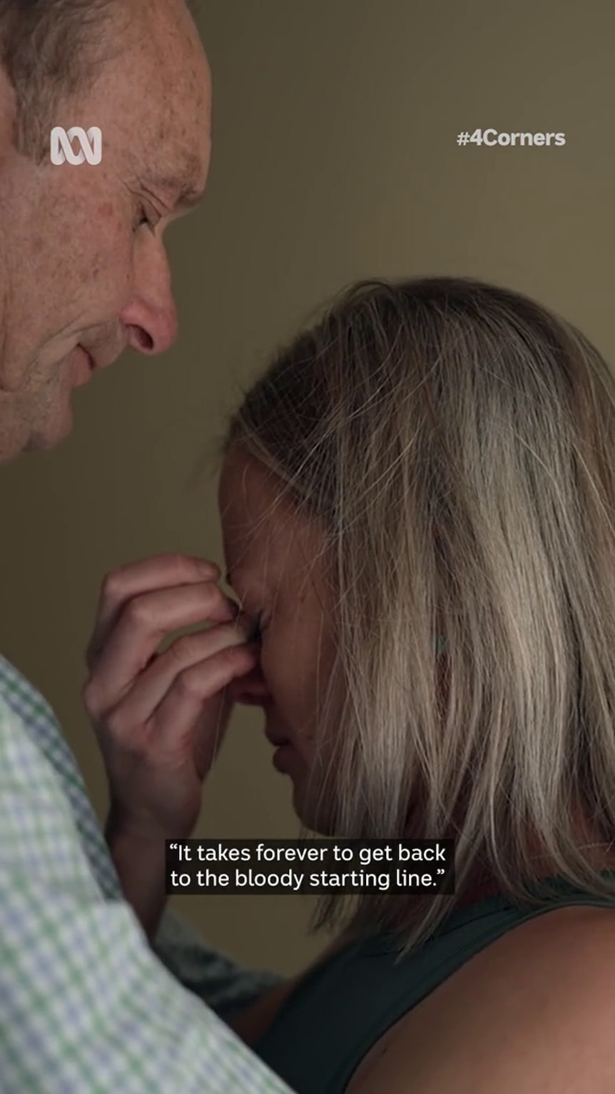 A man with light-tone skin comforts a woman with similar skin who has her hand up to her eyes