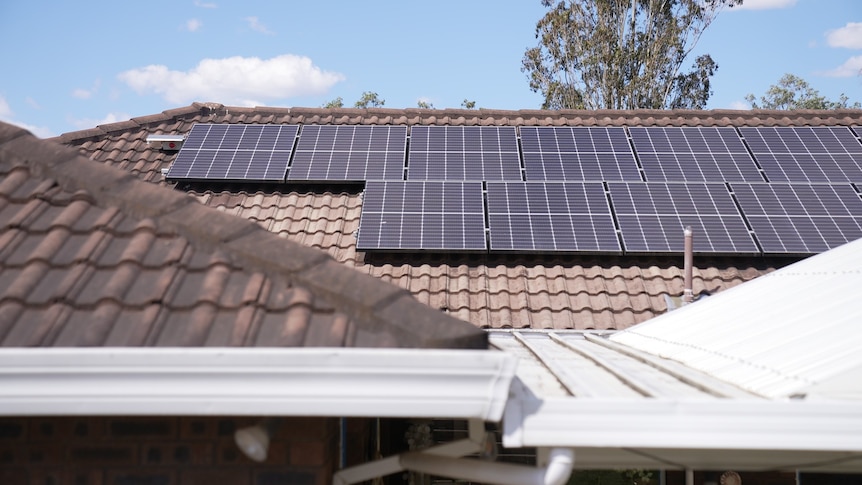 a house with solar panels on the roof