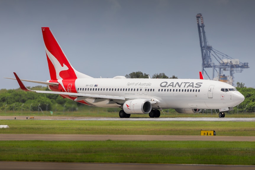 Qantas plane on the runway at Brisbane airport