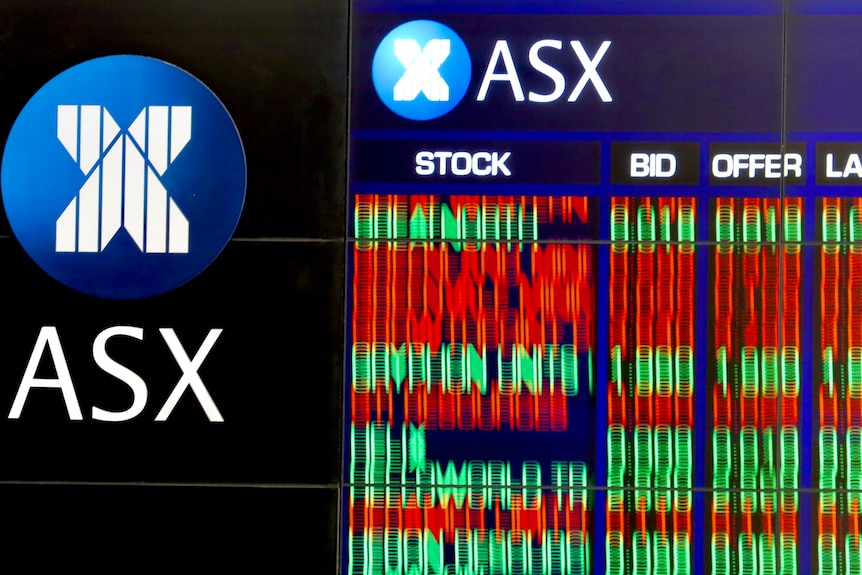 A blurred photo of the share trading boards at the Australian stock exchange 