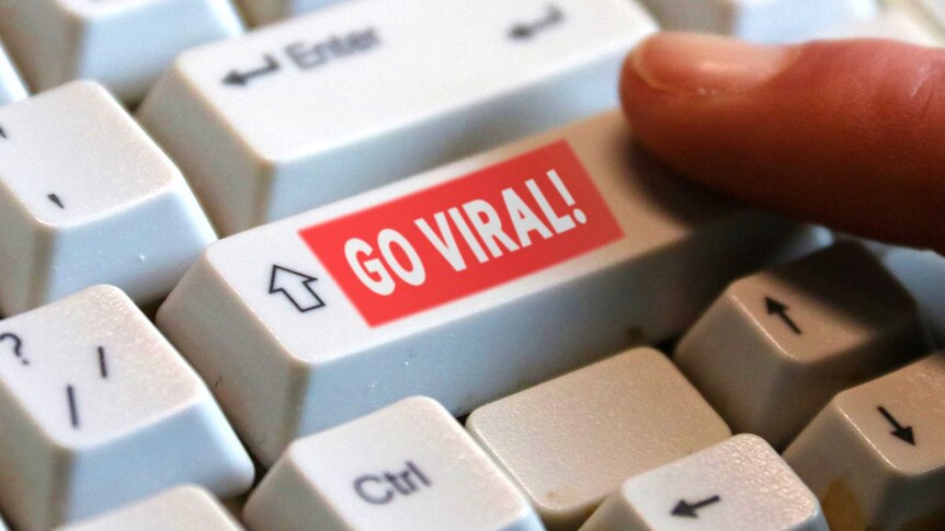 A keyboard with a superimposed 'go viral' button on the shift key.