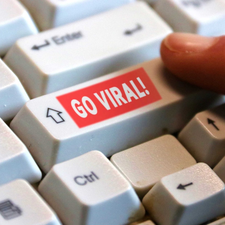 A keyboard with a superimposed 'go viral' button on the shift key.