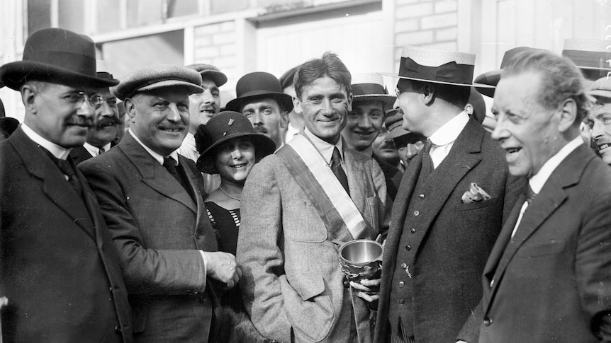 Henri Pelissier stands in a crowd