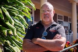 First Nations man Terry Murray crosses arm outside Atherton Courthouse, where he works as a court support officer.