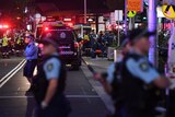 emergency services crowded on the street outside the shopping centre