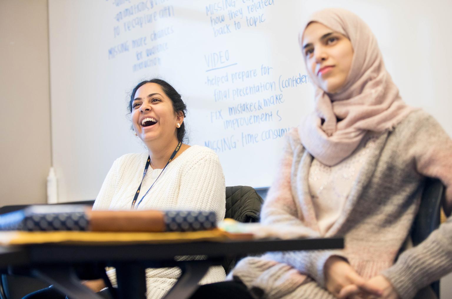 Shruthi Tejaswini Pelluri, B.D.S., left, and Meaad Mohammed ALAmri, RDH, BSDH, graduate students in the MS Dental Hygiene program, participate in a group discussion in the “Leadership in Dental Hygiene” class