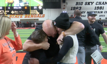 Head Coach Charlie Ragle celebrating with family after win