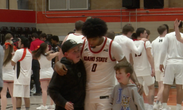 AJ Burgin celebrates with fans after ISU's win