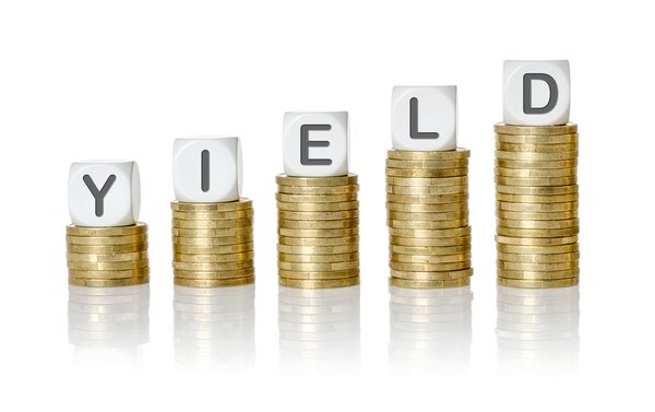 Block letters spelling out YIELD, sitting atop stacks of gold coins.