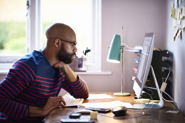 Person reading something on a computer screen.