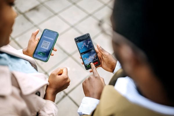 Young colleagues checking their crypto investment app