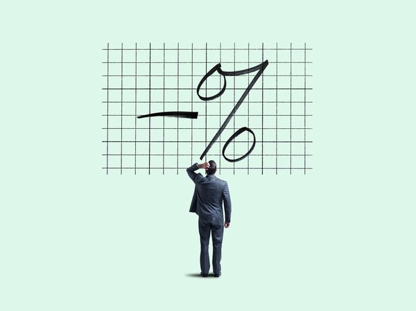 Man staring at negative percentage sign.