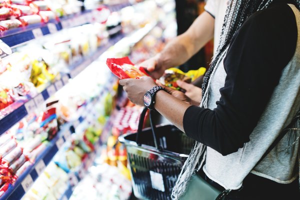 Shoppers pick up items at a grocery store.