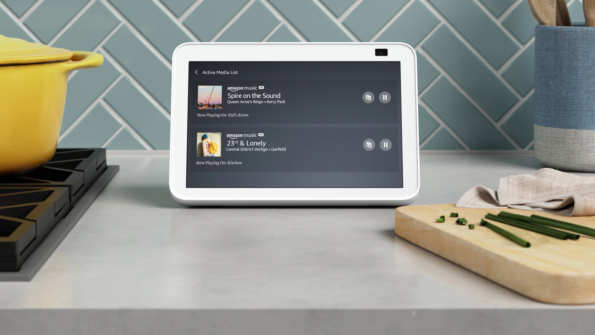 Photo of an Echo Show on a kitchen counter displaying music portability function