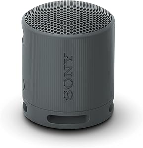 Sony SRS-XB100 Wireless Bluetooth Portable Lightweight Super-Compact Travel Speaker, Extra-Durable IP67 Waterproof &amp; Dustproof, 16 Hour Battery, Versatile Strap, and Hands-Free Calling, Black New