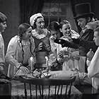 June Lockhart, Muriel Kearney, Terry Kilburn, Gene Lockhart, Kathleen Lockhart, William Martin, and John O'Day in A Christmas Carol (1938)