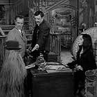 John Astin, Carolyn Jones, Eddie Quillan, and Felix Silla in The Addams Family (1964)