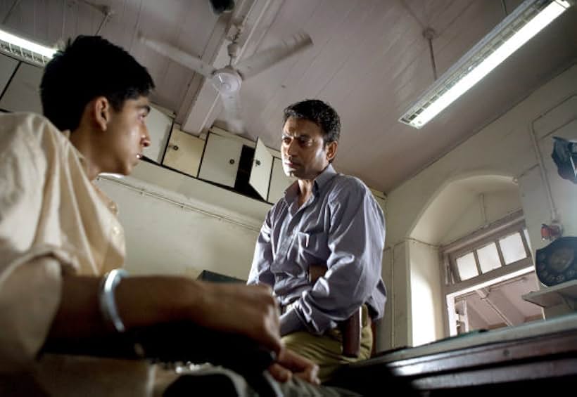 Irrfan Khan and Dev Patel in Slumdog Millionaire (2008)