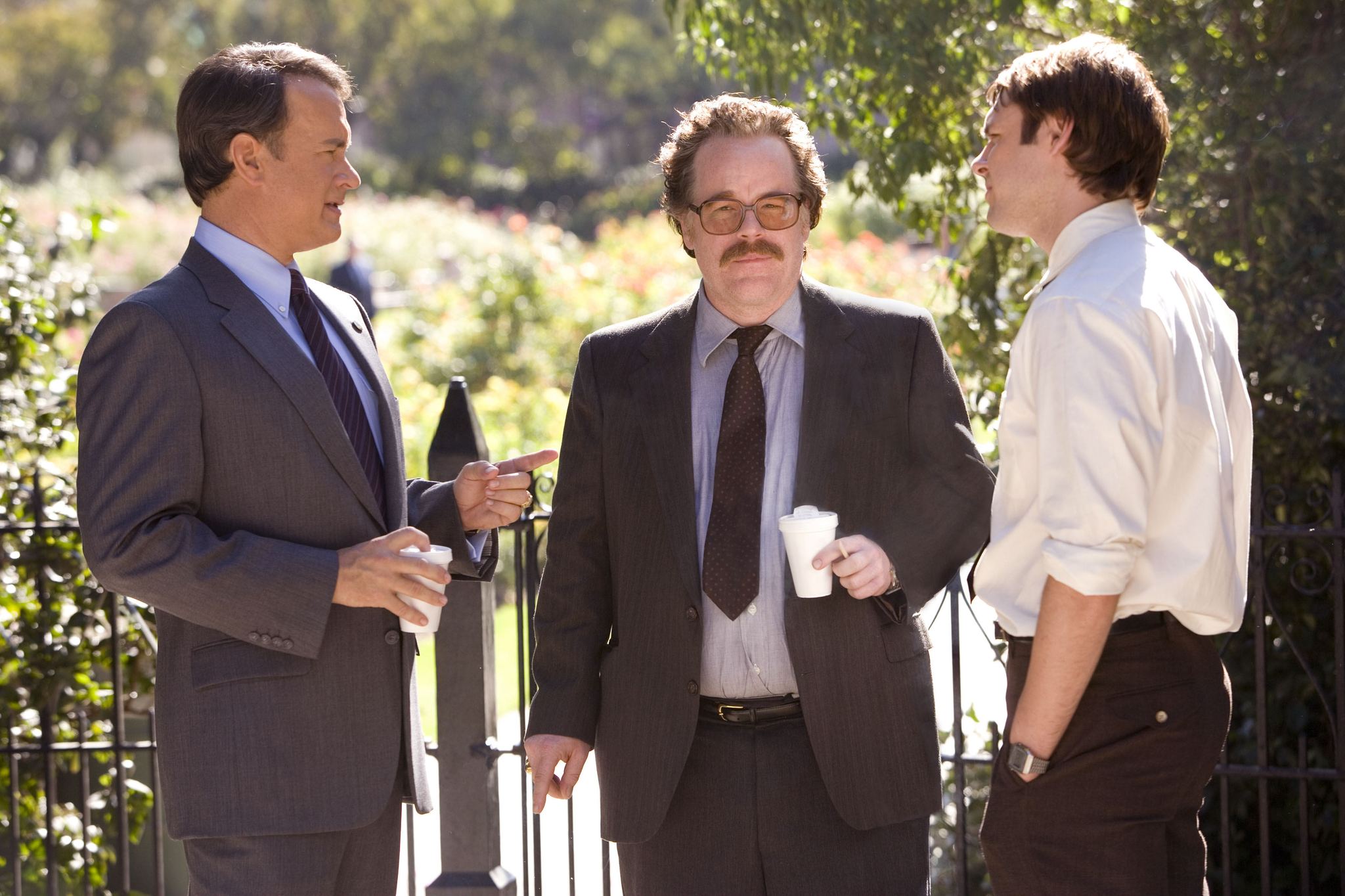 Tom Hanks, Philip Seymour Hoffman, and Christopher Denham in Charlie Wilson's War (2007)