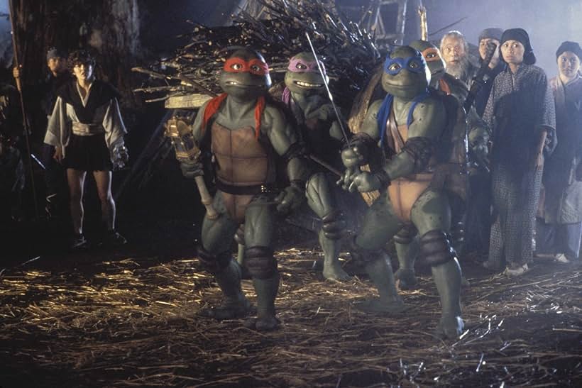 Corey Feldman, Mark Caso, David Fraser, Matt Hill, Tim Kelleher, Jim Raposa, Robbie Rist, Brian Tochi, and Paige Turco in Teenage Mutant Ninja Turtles III (1993)