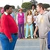 Arthur (J. Mack Slaughter, Jr. right) confronts Fat Albert (Kenan Thompson) on the track.  Observing in the background are (L-R) Mushmouth (Jermaine Williams), Dumb Donald (Marques B. Houston), Rudy (Shedrack Anderson III), Lauri (Dania Ramirez), Old Weird Harold (Aaron A. Frazier), Doris (Kyla Pratt) and Bucky (Alphonso McAuley).