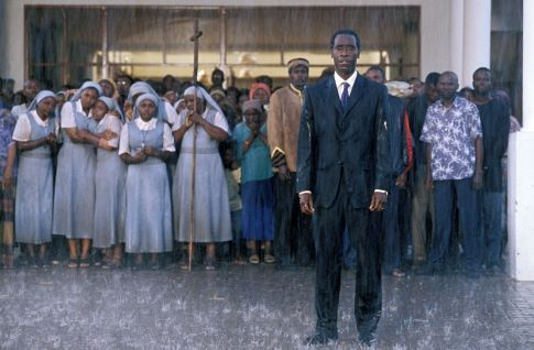 Don Cheadle, Desmond Dube, Harriet Lenabe, Rosie Motene, and Eugene Khumbanyiwa in Hotel Rwanda (2004)